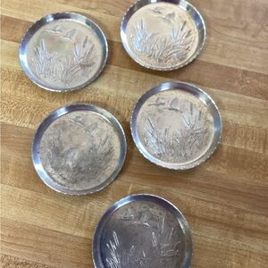 Set of Silver Coasters with Engraved Design